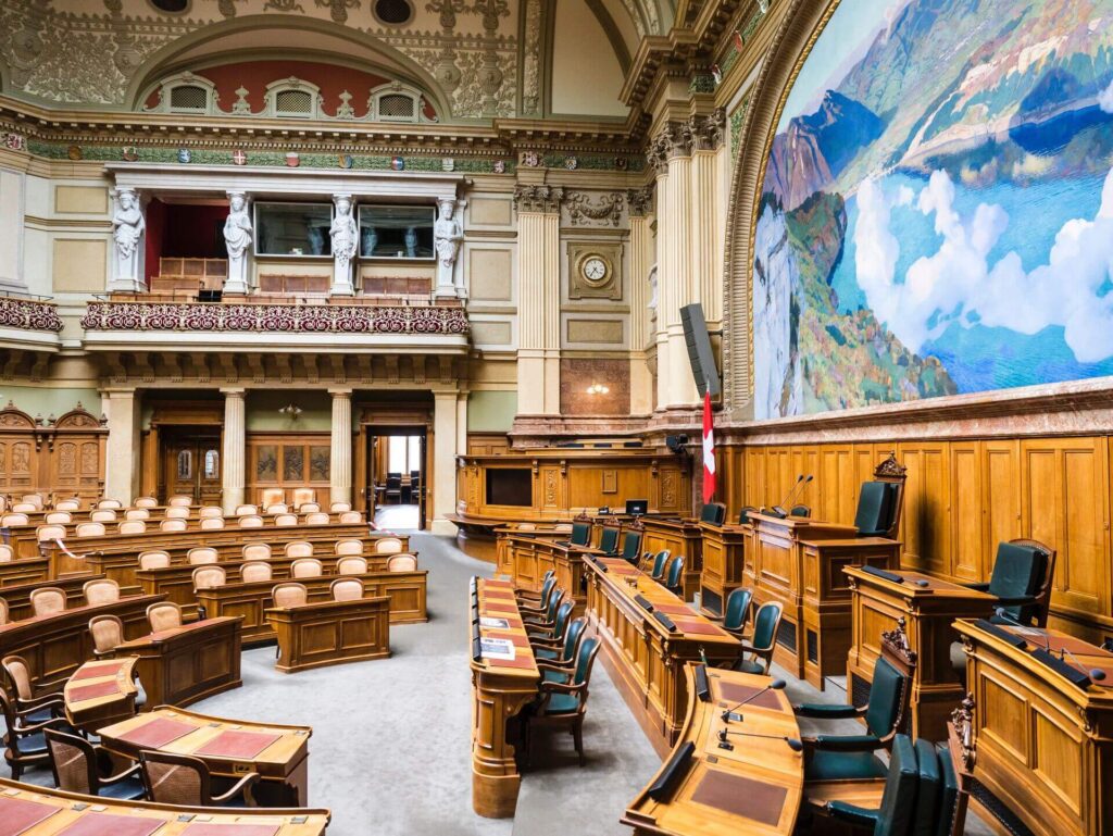 A photograph of a courtroom from the side.