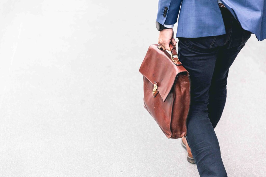 a person carrying a briefcase studying overtime laws