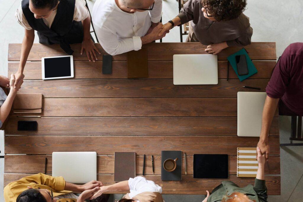 A group of people having an employee classification meeting