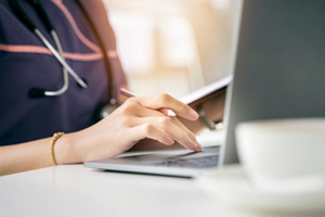 nurse hand using laptop